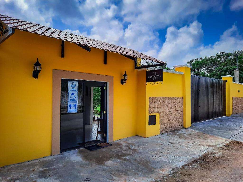 The yellow entrance of Hotel Quinta Izamal